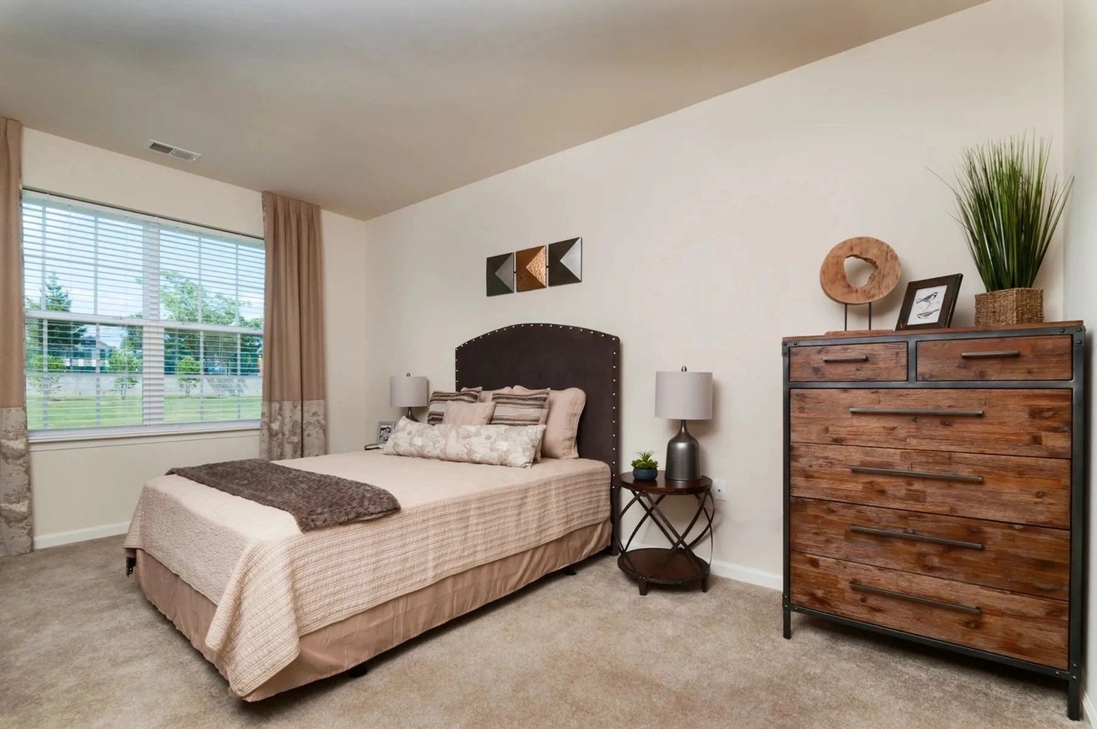 Warmly staged model bedroom